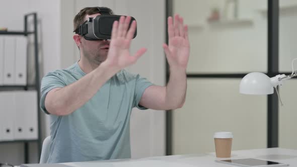 Young Man Using VR Head Set