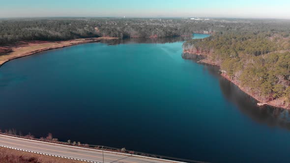 4k aerial footage of a lakefront road in Columbia, SC.