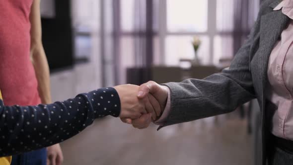  Shaking Hands with Real-estate Agent