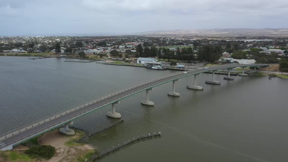 Aerial footage of a bridge across water near Goolwa in regional South Australia in Australia