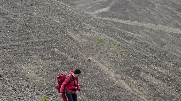 Solo Woman Hiker Descending Slope