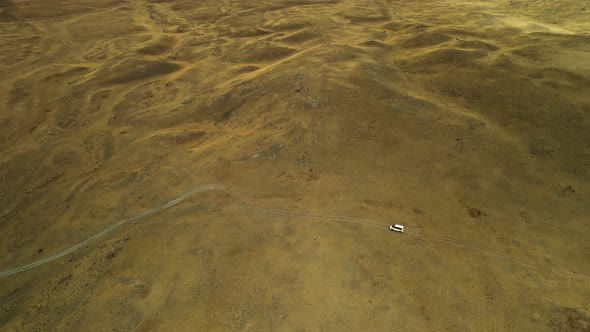 Shooting a Car Moving Through the Desert Steppe From a Great Height