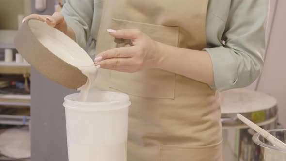 Artisan Painting Earthenware in Ceramic Workshop