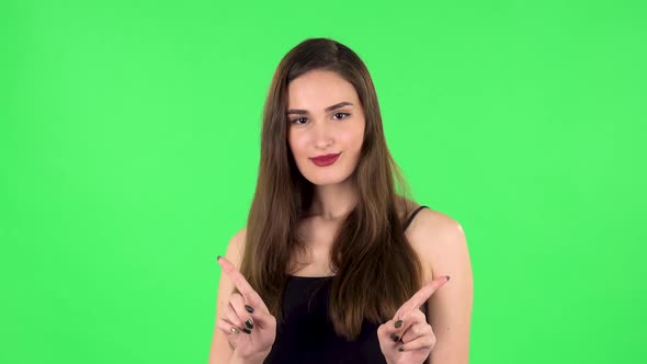 Cute Girl Smiles and Showing Heart with Fingers Then Blowing Kiss. Green Screen