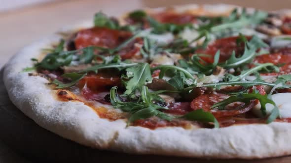 Appetizing Pizza on a Wooden Board in a Restaurant