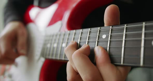 Musician Playing the Guitar During a Live Performance