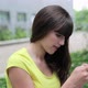 Young woman using cellphone, friend comes and covers her eyes - VideoHive Item for Sale