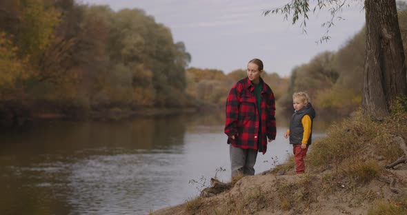 Happy Childhood of Child Boy, Spending Time with Mother at Woodland at Autumn Day, Weekend at Nature