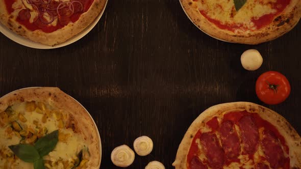 Putting Hot Arugula and Cheese Pizza on the Wooden Table