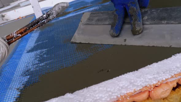 Industrial Climber Using Trowel Putty Glue on Fiberglass Mesh To Insulate Facade