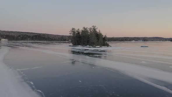 Dusk at Moosehead Lake in winter. Maine. USA. Aerial approach
