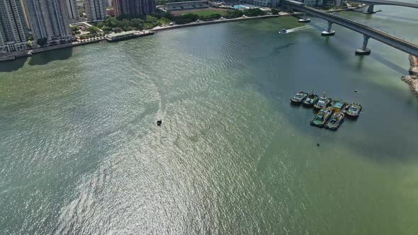 Boat cruising in middle of Rambler Channel in Tsuen Wan, Hong Kong; aerial