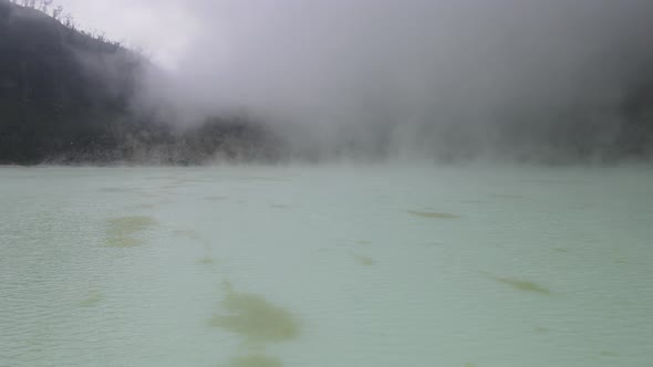 Aerial view fly through smoky in white crater, bandung, Indonesia