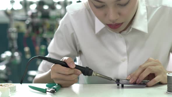 Woman working with microchip electronic