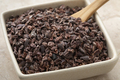 Cacao nibs close up in a ceramic bowl - PhotoDune Item for Sale