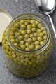 Glass jar with small green peas close up - PhotoDune Item for Sale