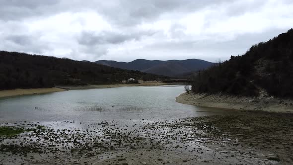 Mountain lake, muddy green water color