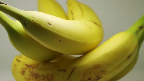 Yellow Ripe Bananas On Pure White Background - Close Up Shot
