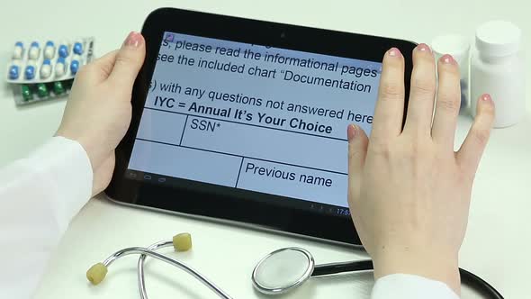 Female M.D. Studying Medical Documentation on Tablet PC, Modern Technologies
