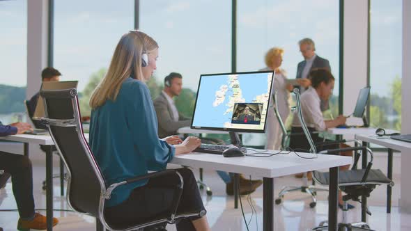 Woman browsing online map on monitor