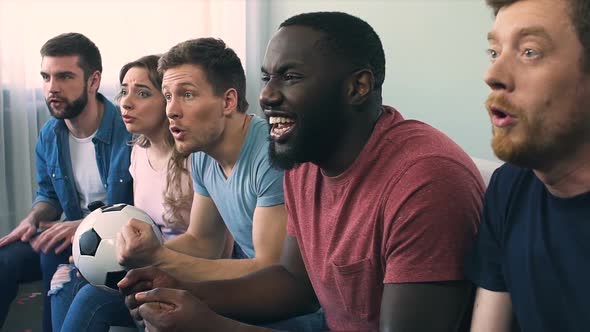 Friends Watching Final of Football Game Excited With Crucial Scored Goal