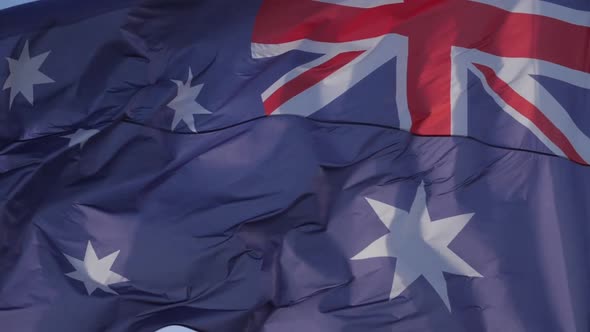 The national australian flag waving in the wind.