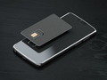 Blank black SIM smart card and mobile phone or smartphone on black table. Mock up. - PhotoDune Item for Sale