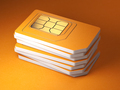Stack of orange sim smart cards for mobile phone. - PhotoDune Item for Sale