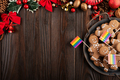 Christmas background of tray with gingerbread cookie men and rainbow flags on wooden table - PhotoDune Item for Sale