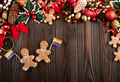 Christmas background of gingerbread cookie men with rainbow flags on wooden table - PhotoDune Item for Sale
