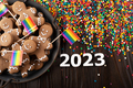 New year background of tray with gingerbread cookie men, rainbow flags and sprinkles - PhotoDune Item for Sale