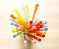 Colorful plastic cocktail straws in glass, top view - PhotoDune Item for Sale