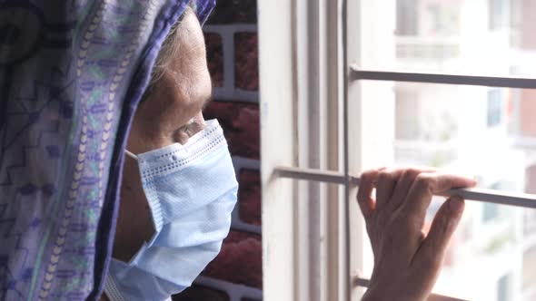 Senior Woman Wearing Protective Face Mask Close Up