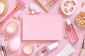 Paper card between skin care and decorative cosmetics on pink, top view, mockup - PhotoDune Item for Sale