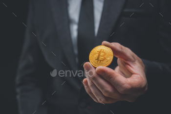 tocurrency, closeup of hand with crypto coin, selective focus