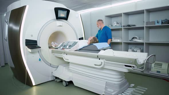 Magnetic Resonance Imaging in the Modern Hospital Adult Man Doctor Performs a Magnetic Tomographic