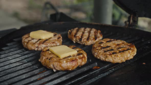 a Meat Patty Being Prepared on a Griller