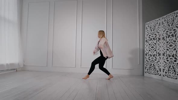 Young Athletic Girl Dancing with a Tied Ribbon on Her Hand