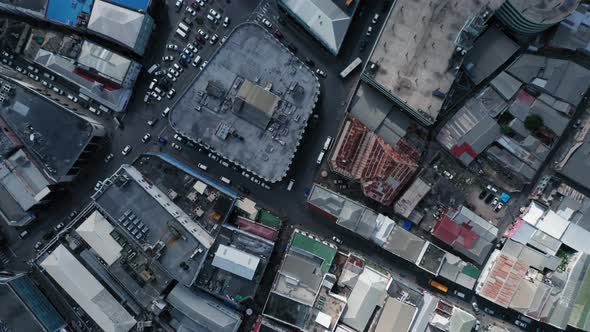 Overhead drone shot of road with cars and roofs with solar panels in Bridgetown, Barbados