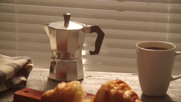 Food and Drink Concept. Morning Breakfast - Coffee and Croissant on a Table