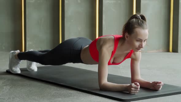 Woman Plays Sports in the Gym