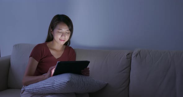 Woman work on tablet computer at home