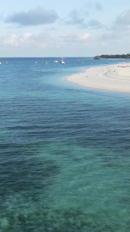 Vertical Video Boats in the Ocean Near the Coast of Zanzibar Tanzania