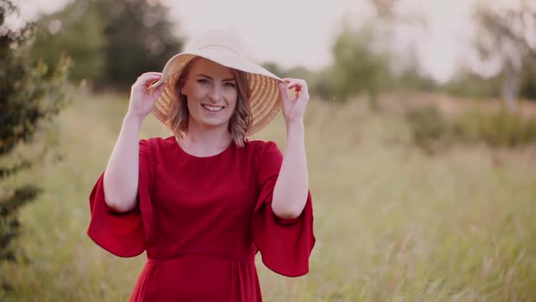 Smiling Woman Wearinh Hat, Laughing and Looking Into Camera