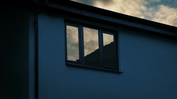 House Window Reflecting Sunrise