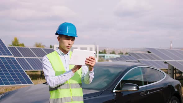 Good Looking Asian Man Industrial Mechanic Using