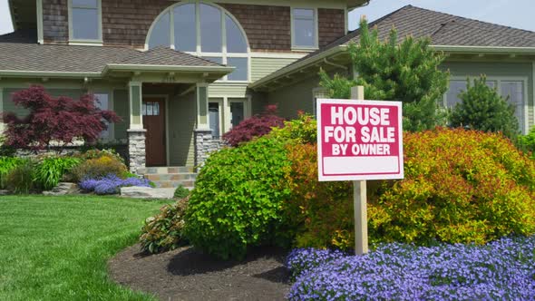 New custom home with 'FOR SALE' sign