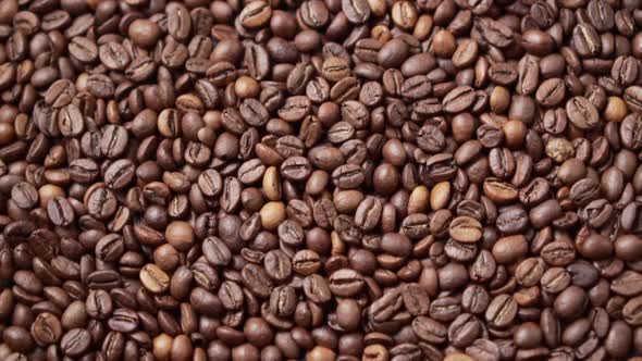 Dark Roasted Coffee Beans Move in a Circle.