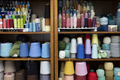 Shelves covered in spools of colorful yarn waiting for crocheting or knitting. - PhotoDune Item for Sale