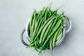 Green beans. Fresh raw organic Green beans in colander on gray stone background, top view - PhotoDune Item for Sale